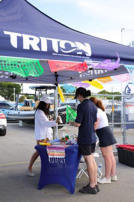 Guests networking at The Triton's Crew, Captains & Connections event at Nautical Ventures Marina.