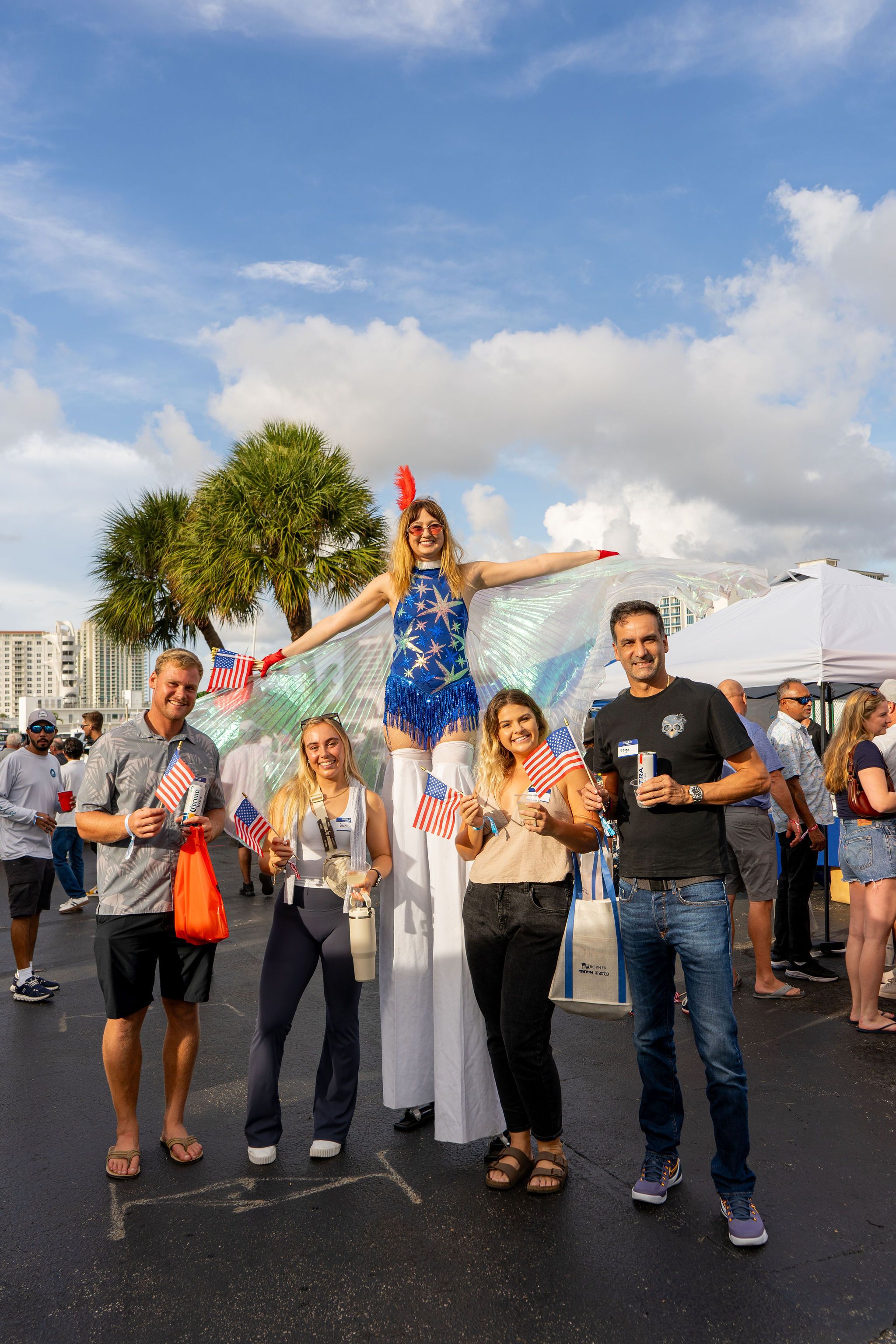 Guests in candid and group photos at The Triton's Fall Triton Expo at Bahia Mar Yachting Center.