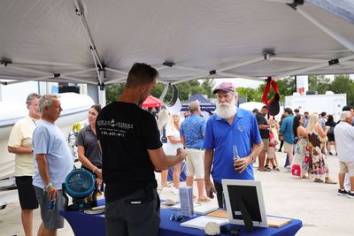 Guests networking at The Triton's Crew, Captains & Connections event at Nautical Ventures Marina.