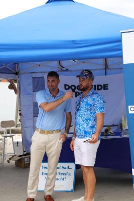 Guests networking at The Triton's Crew, Captains & Connections event at Nautical Ventures Marina.