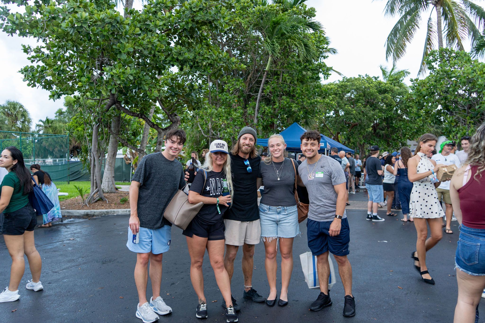 Guests in candid and group photos at The Triton's Fall Triton Expo at Bahia Mar Yachting Center.