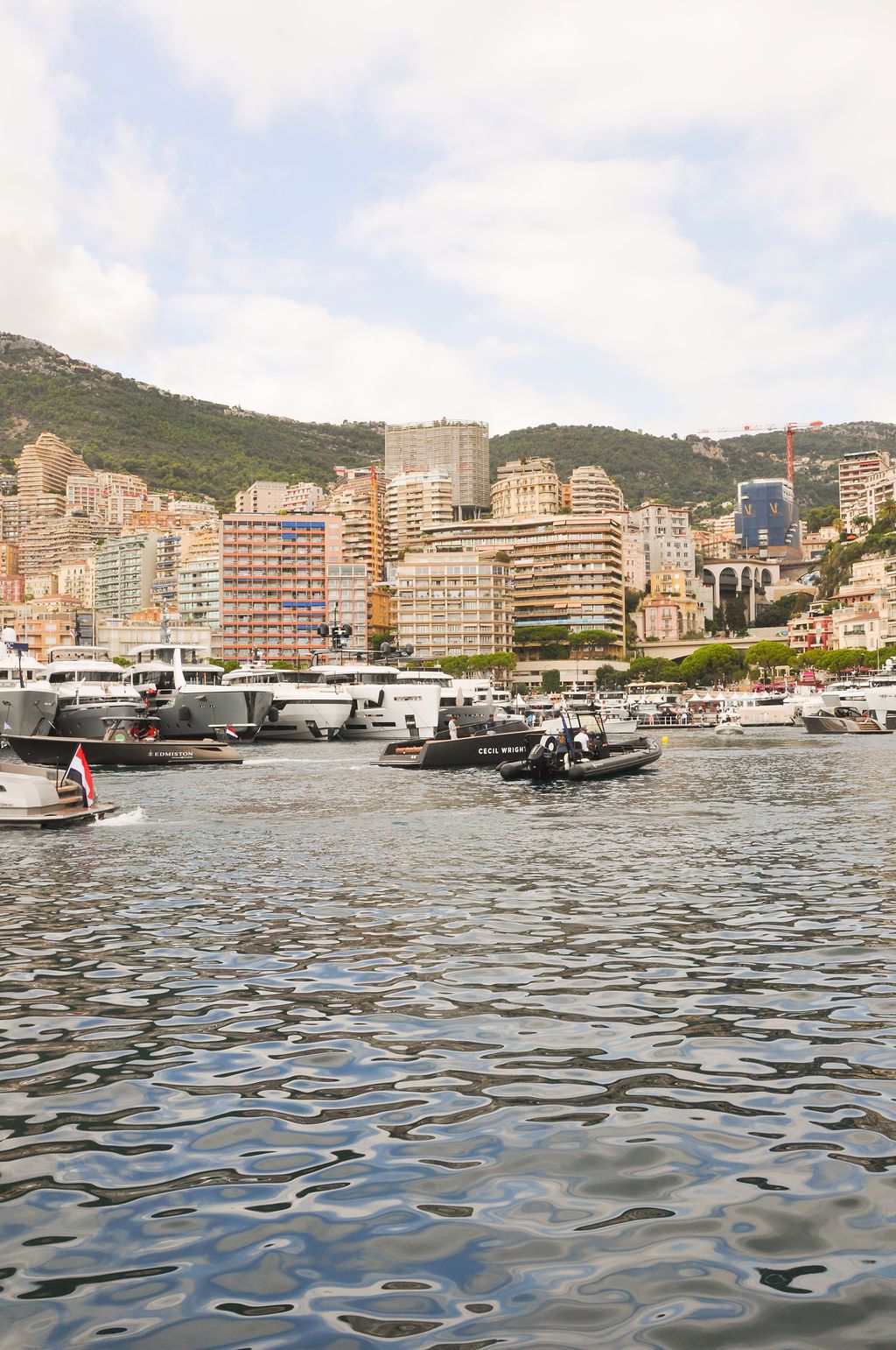 Yachts and crew on the docks at the 2026 Monaco Yacht Show in Port Hercule, Monaco.