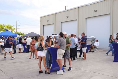 Guests networking at The Triton's Crew, Captains & Connections event at Nautical Ventures Marina.