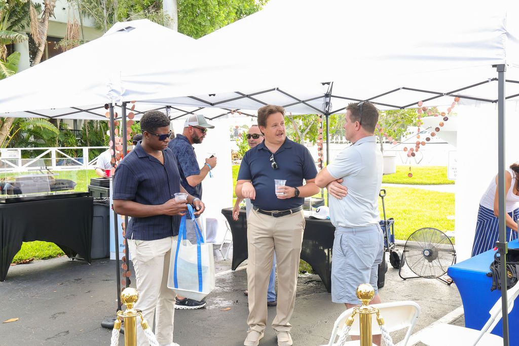 Guests and exhibitors at The Triton's Fall Triton Expo at Bahia Mar Yachting Center.
