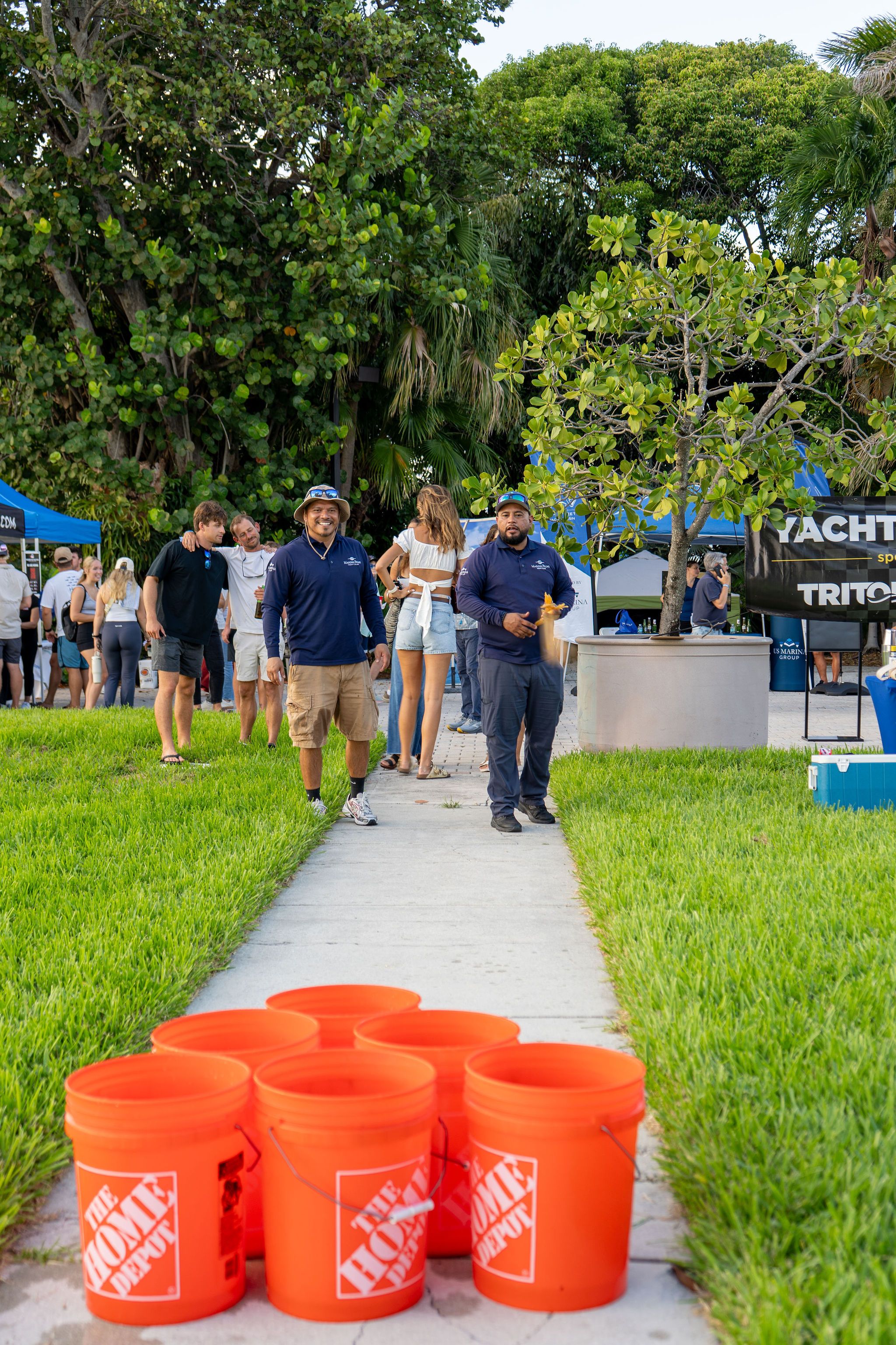 Guests in candid and group photos at The Triton's Fall Triton Expo at Bahia Mar Yachting Center.