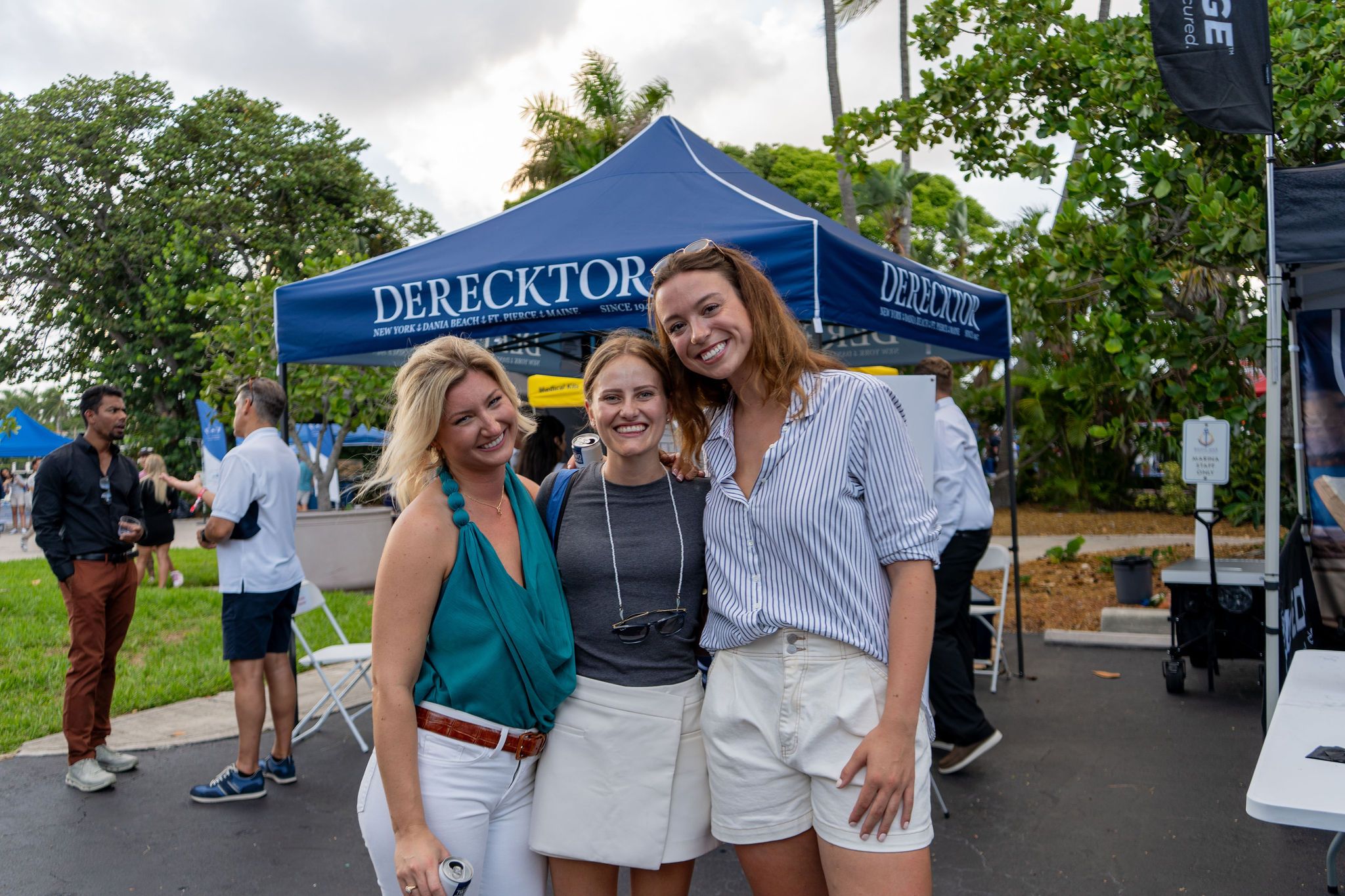Guests in candid and group photos at The Triton's Fall Triton Expo at Bahia Mar Yachting Center.
