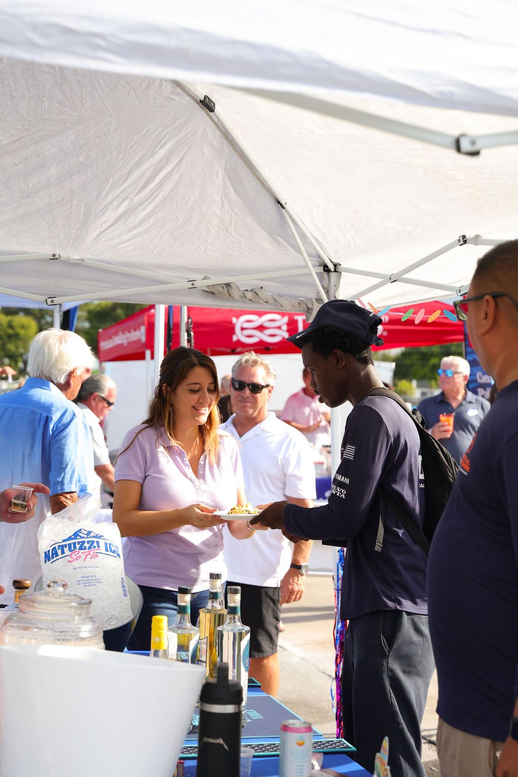 Guests networking at The Triton's Crew, Captains & Connections event at Nautical Ventures Marina.