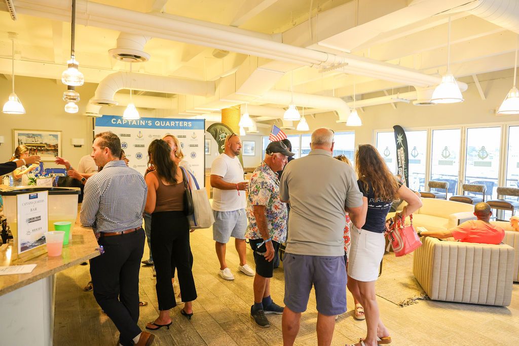 Guests and exhibitors at The Triton's Fall Triton Expo at Bahia Mar Yachting Center.
