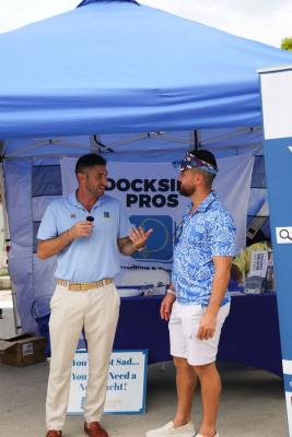 Guests networking at The Triton's Crew, Captains & Connections event at Nautical Ventures Marina.