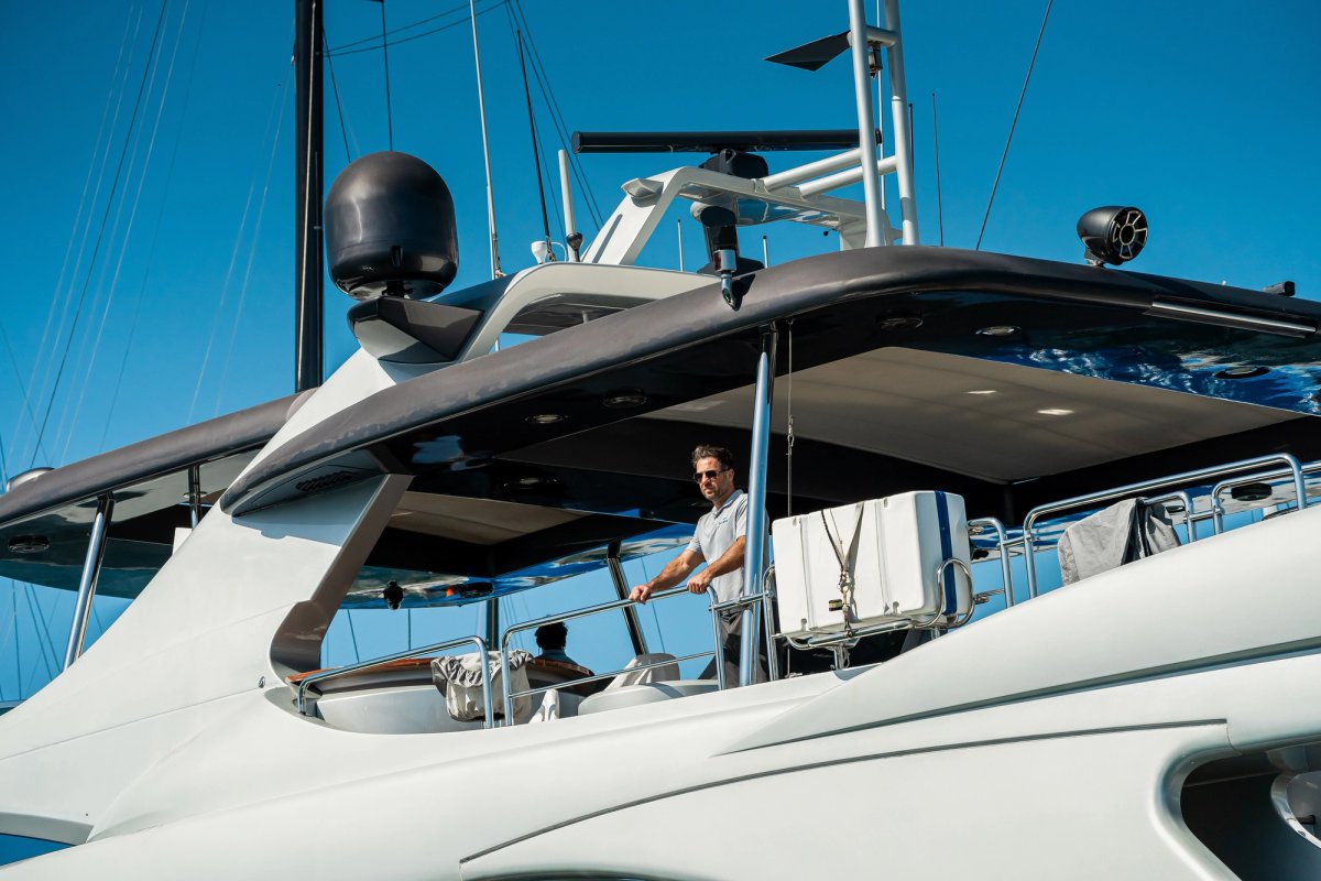 Yacht crew cleaning a deck