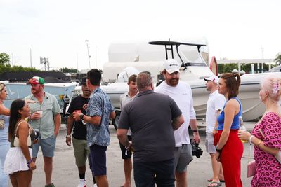 Guests networking at The Triton's Crew, Captains & Connections event at Nautical Ventures Marina.
