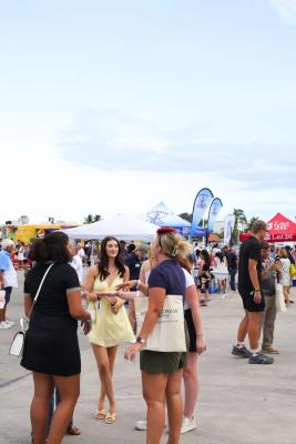 Guests networking at The Triton's Crew, Captains & Connections event at Nautical Ventures Marina.