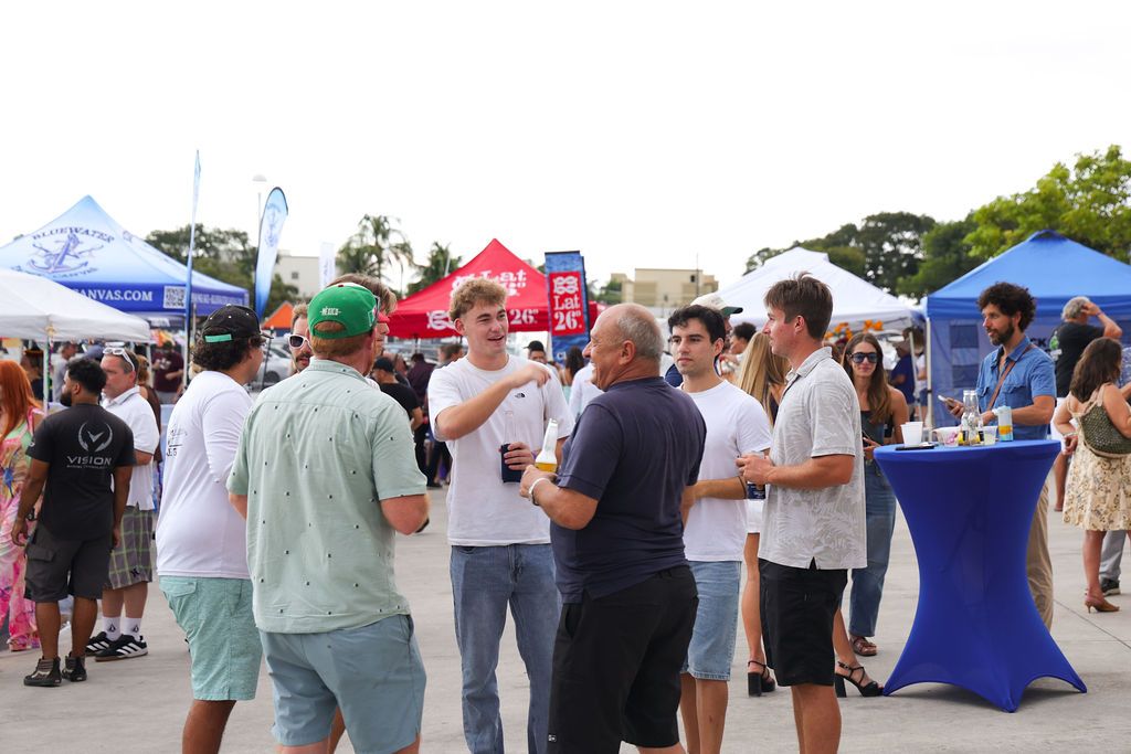 Guests networking at The Triton's Crew, Captains & Connections event at Nautical Ventures Marina.