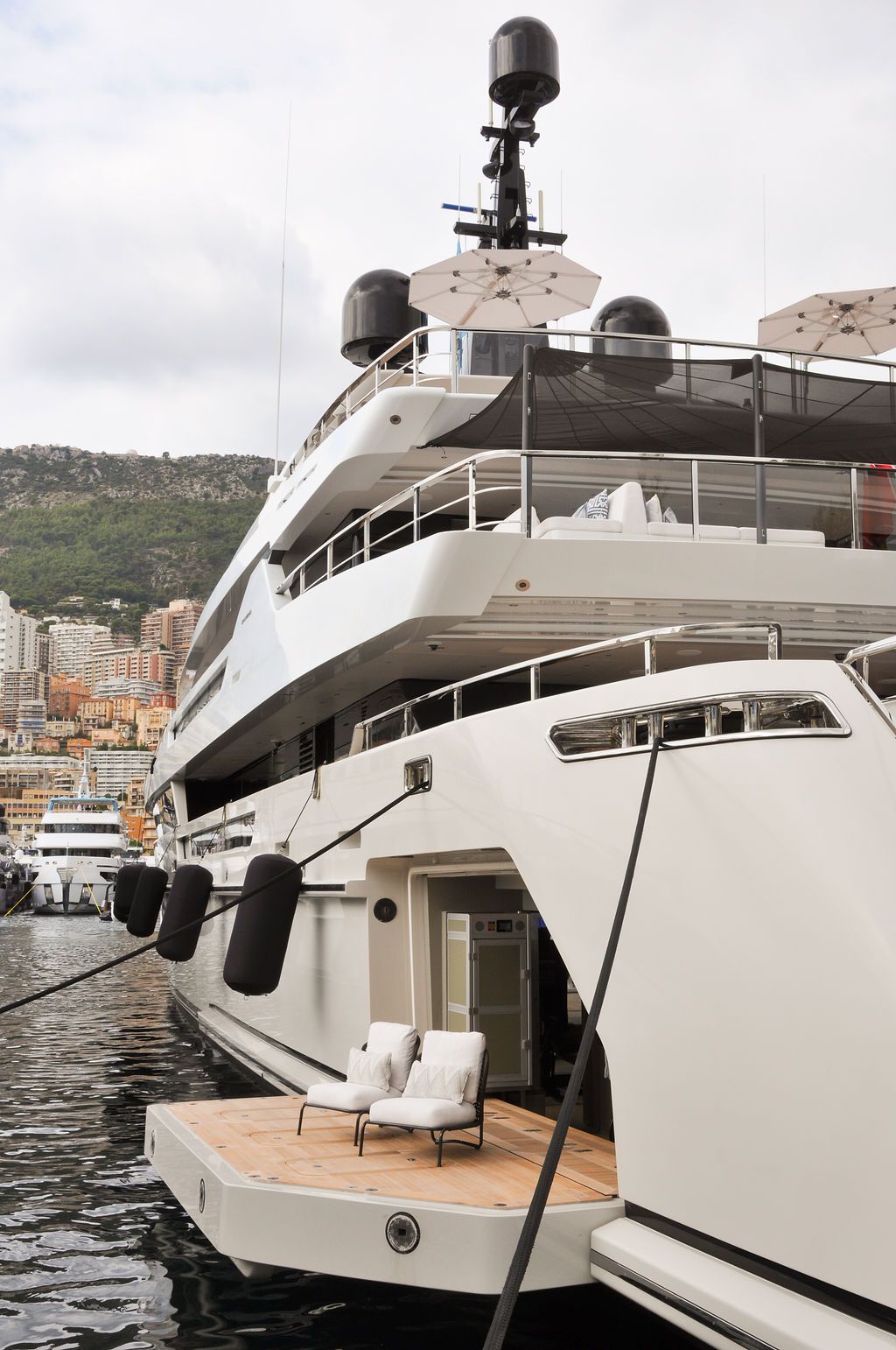 Yachts and crew on the docks at the 2026 Monaco Yacht Show in Port Hercule, Monaco.