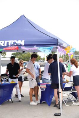 Guests networking at The Triton's Crew, Captains & Connections event at Nautical Ventures Marina.
