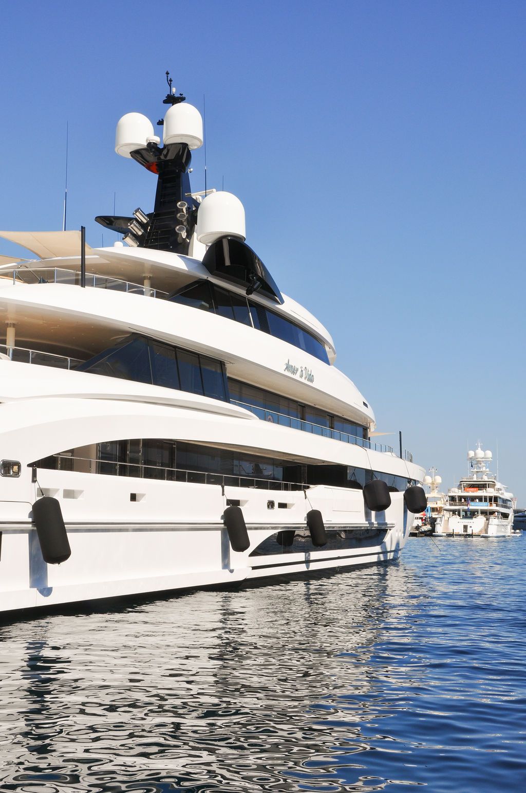 Yachts and crew on the docks at the 2026 Monaco Yacht Show in Port Hercule, Monaco.