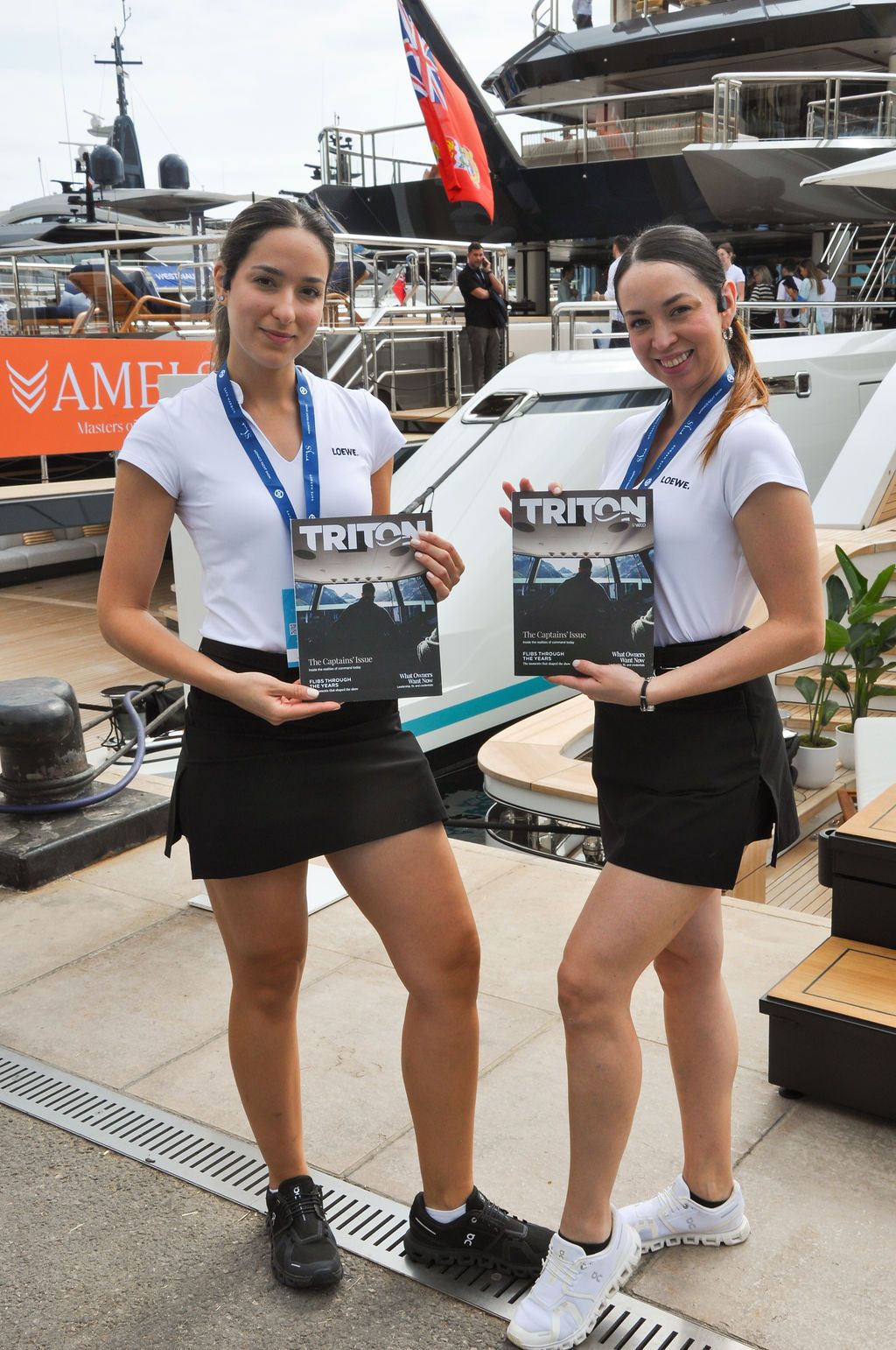 Yachts and crew on the docks at the 2026 Monaco Yacht Show in Port Hercule, Monaco.