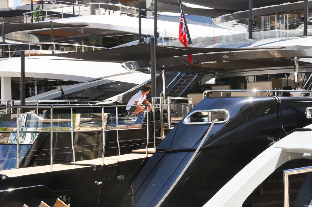 Yachts and crew on the docks at the 2026 Monaco Yacht Show in Port Hercule, Monaco.