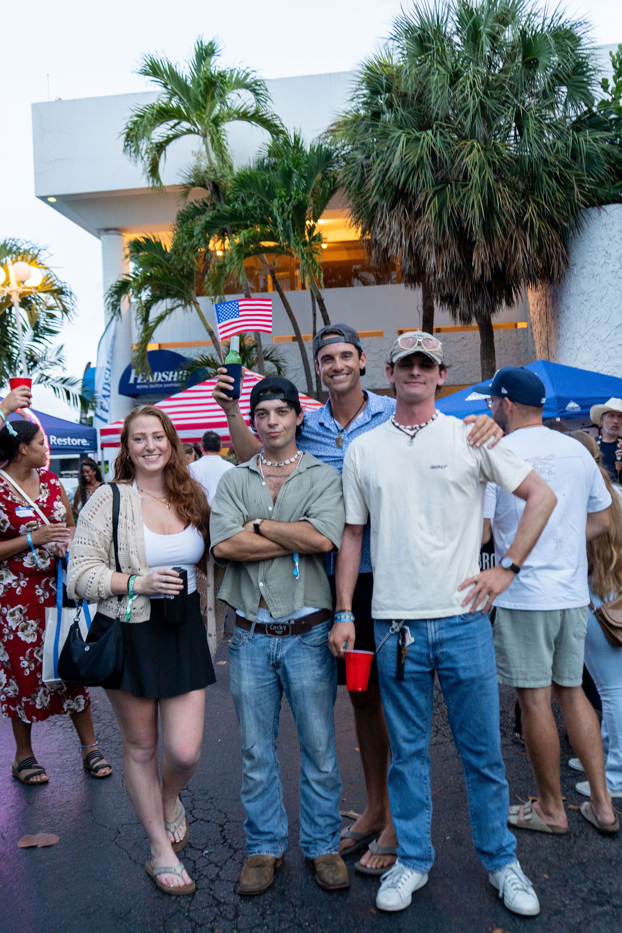 Guests in candid and group photos at The Triton's Fall Triton Expo at Bahia Mar Yachting Center.