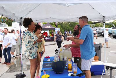 Guests networking at The Triton's Crew, Captains & Connections event at Nautical Ventures Marina.