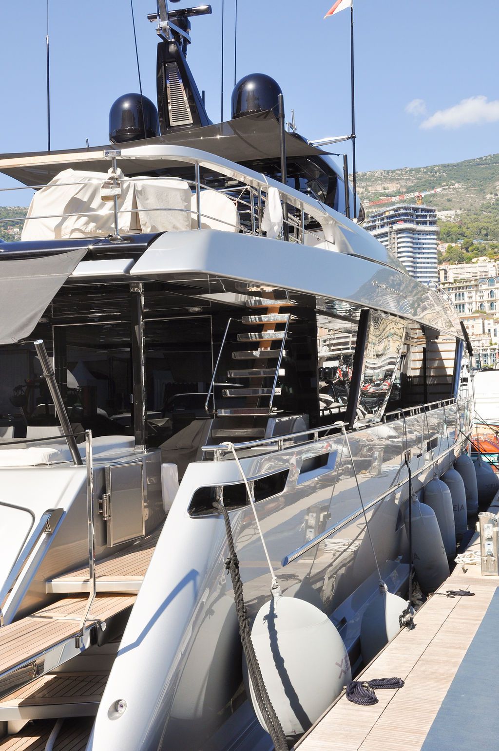 Yachts and crew on the docks at the 2026 Monaco Yacht Show in Port Hercule, Monaco.