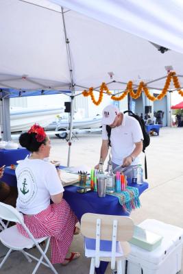 Guests networking at The Triton's Crew, Captains & Connections event at Nautical Ventures Marina.