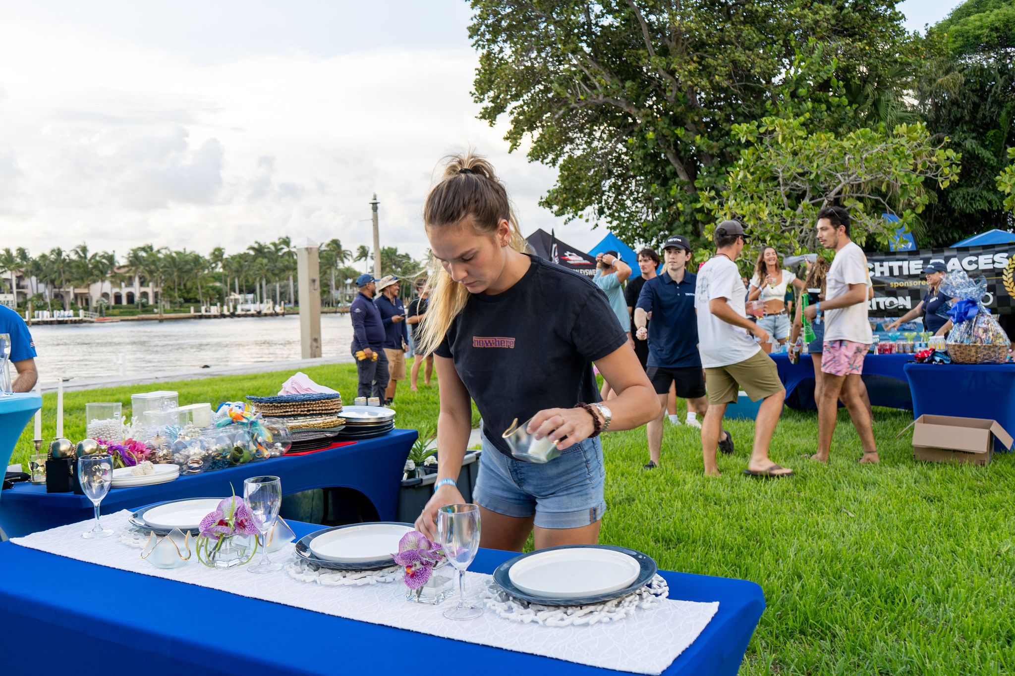 Guests in candid and group photos at The Triton's Fall Triton Expo at Bahia Mar Yachting Center.