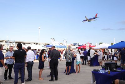 Guests networking at The Triton's Crew, Captains & Connections event at Nautical Ventures Marina.