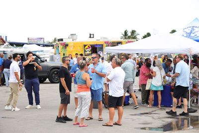 Guests networking at The Triton's Crew, Captains & Connections event at Nautical Ventures Marina.