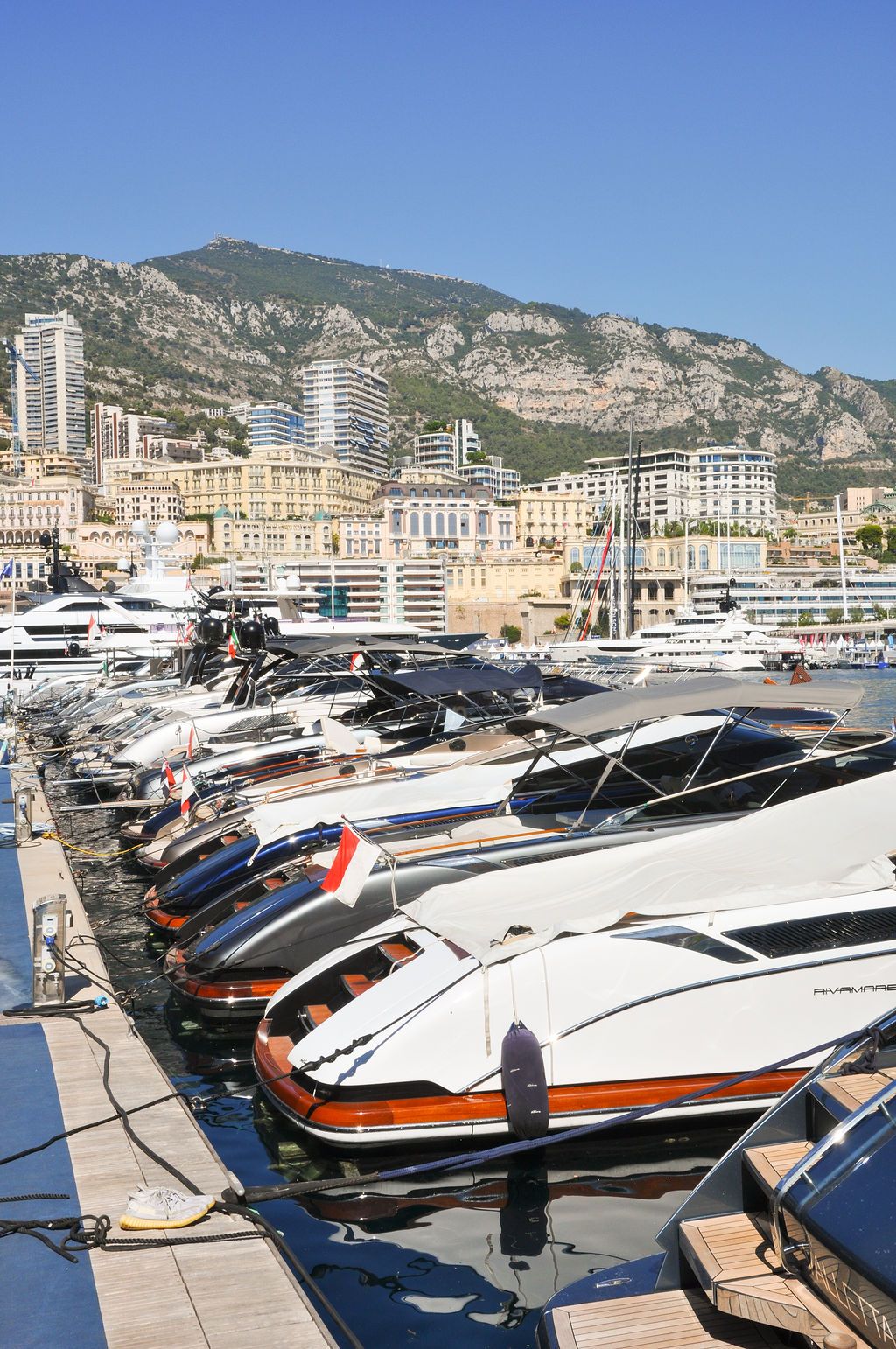 Yachts and crew on the docks at the 2026 Monaco Yacht Show in Port Hercule, Monaco.