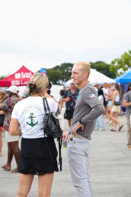 Guests networking at The Triton's Crew, Captains & Connections event at Nautical Ventures Marina.