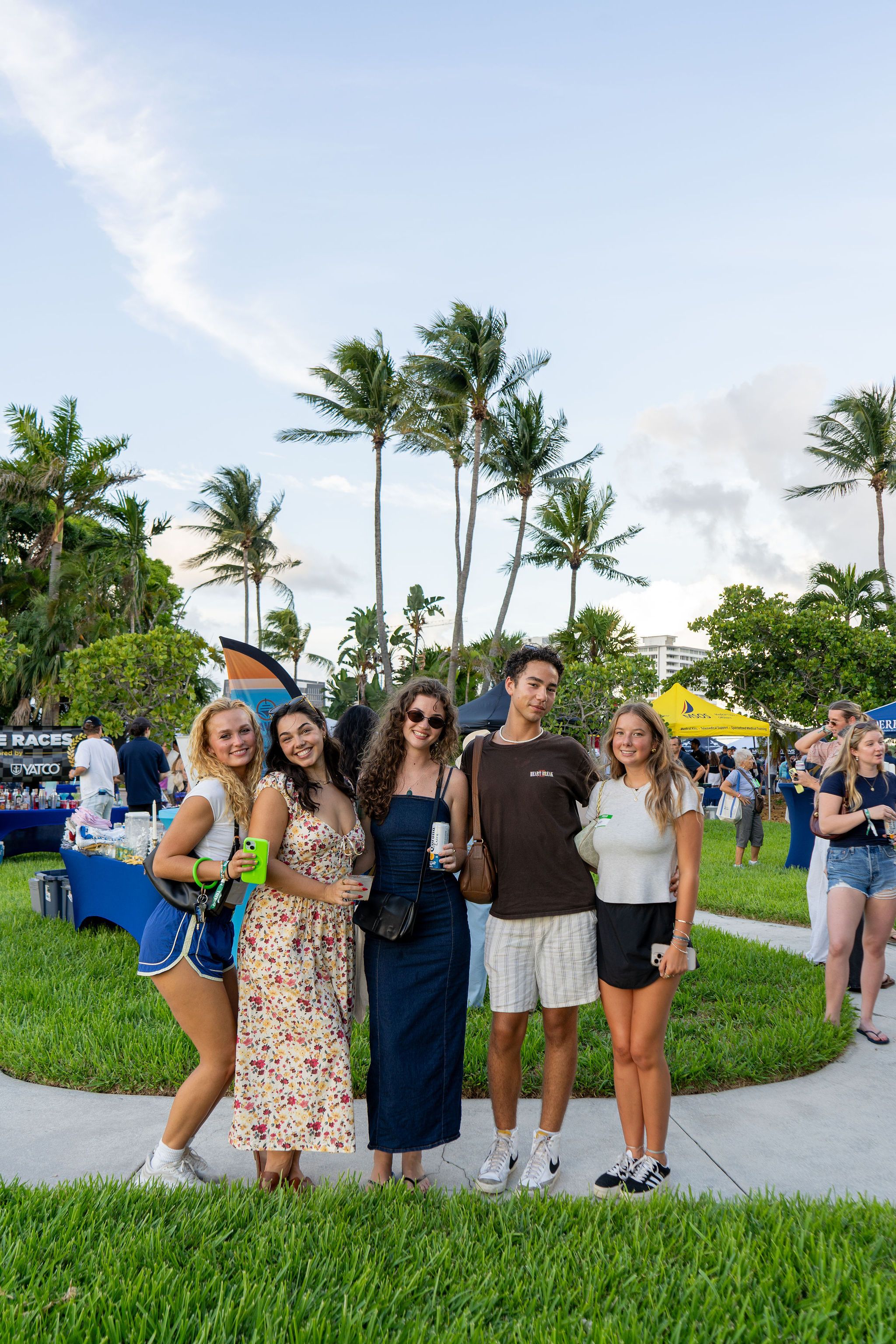 Guests in candid and group photos at The Triton's Fall Triton Expo at Bahia Mar Yachting Center.