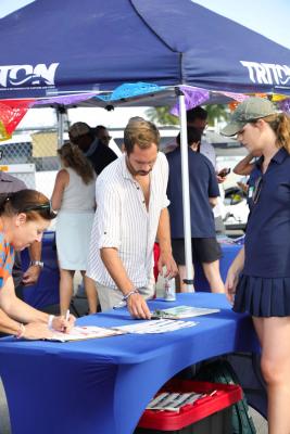Guests networking at The Triton's Crew, Captains & Connections event at Nautical Ventures Marina.