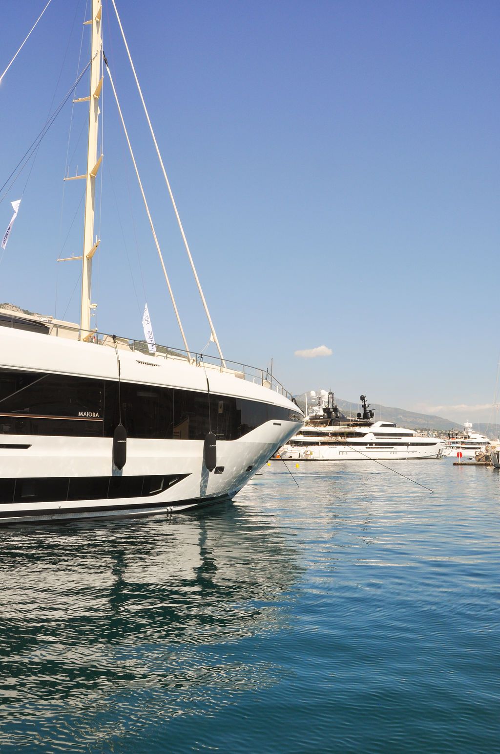 Yachts and crew on the docks at the 2026 Monaco Yacht Show in Port Hercule, Monaco.
