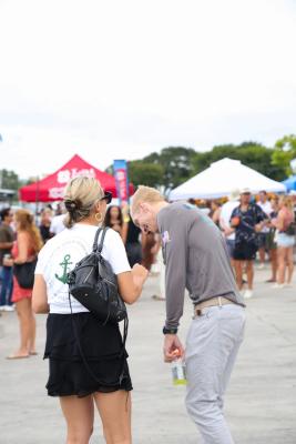 Guests networking at The Triton's Crew, Captains & Connections event at Nautical Ventures Marina.