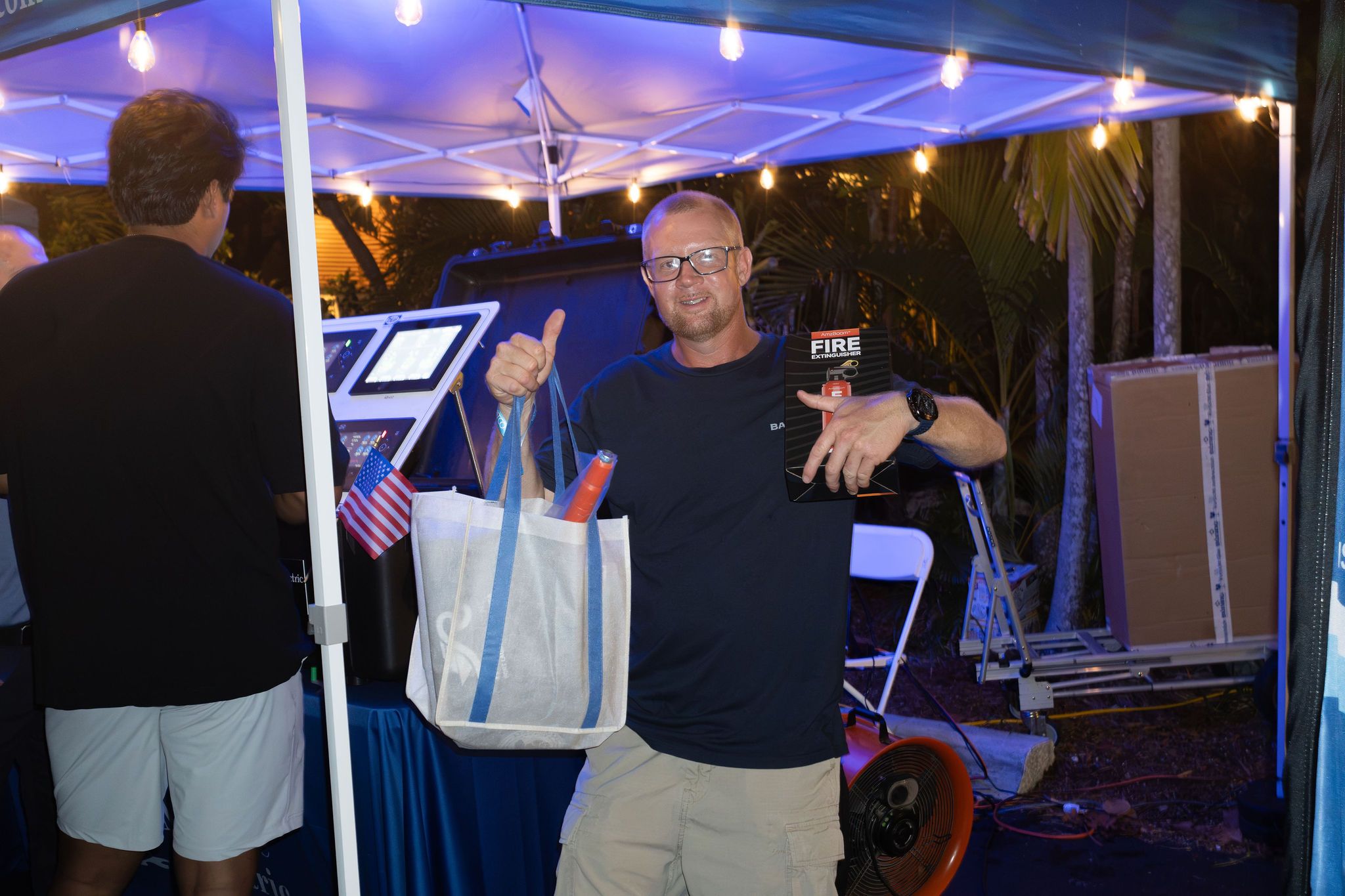 Guests in candid and group photos at The Triton's Fall Triton Expo at Bahia Mar Yachting Center.