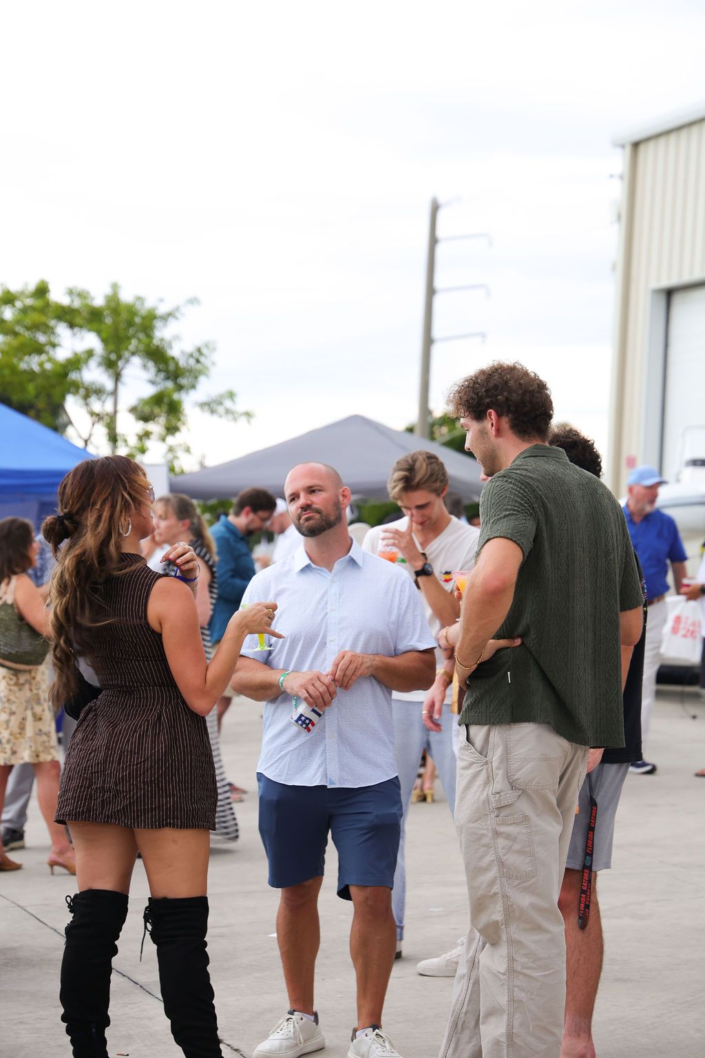 Guests networking at The Triton's Crew, Captains & Connections event at Nautical Ventures Marina.
