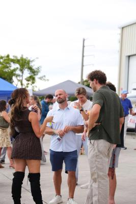 Guests networking at The Triton's Crew, Captains & Connections event at Nautical Ventures Marina.