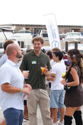 Guests networking at The Triton's Crew, Captains & Connections event at Nautical Ventures Marina.