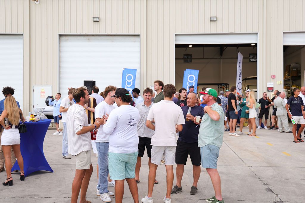Guests networking at The Triton's Crew, Captains & Connections event at Nautical Ventures Marina.