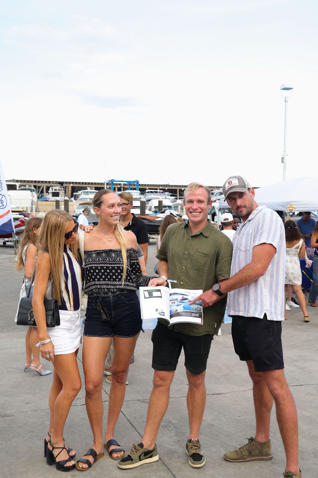 Guests networking at The Triton's Crew, Captains & Connections event at Nautical Ventures Marina.