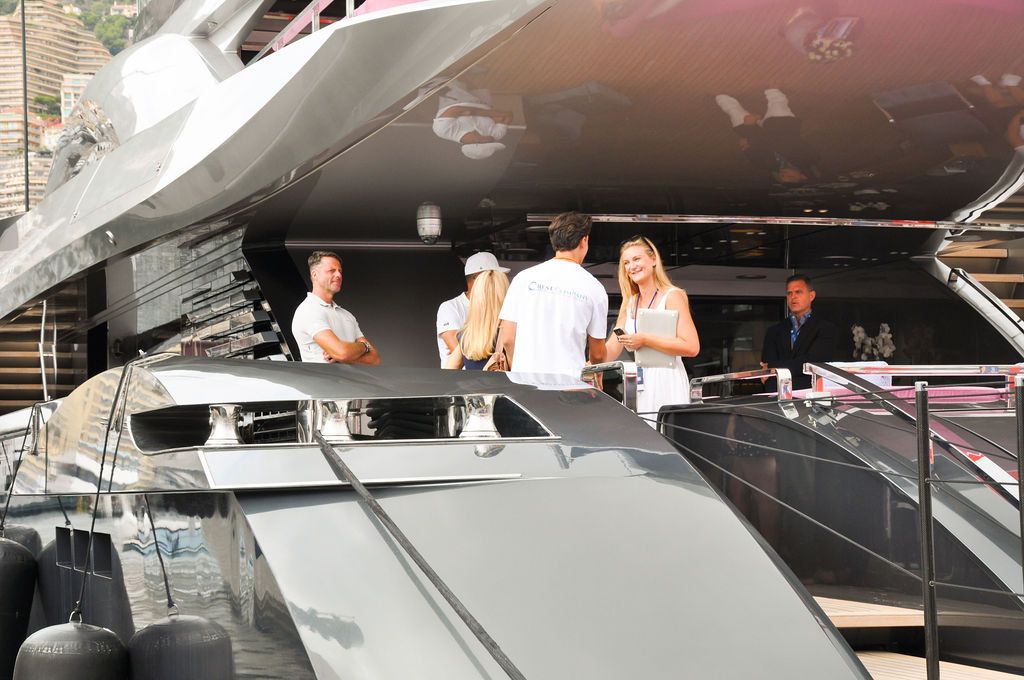Yachts and crew on the docks at the 2026 Monaco Yacht Show in Port Hercule, Monaco.