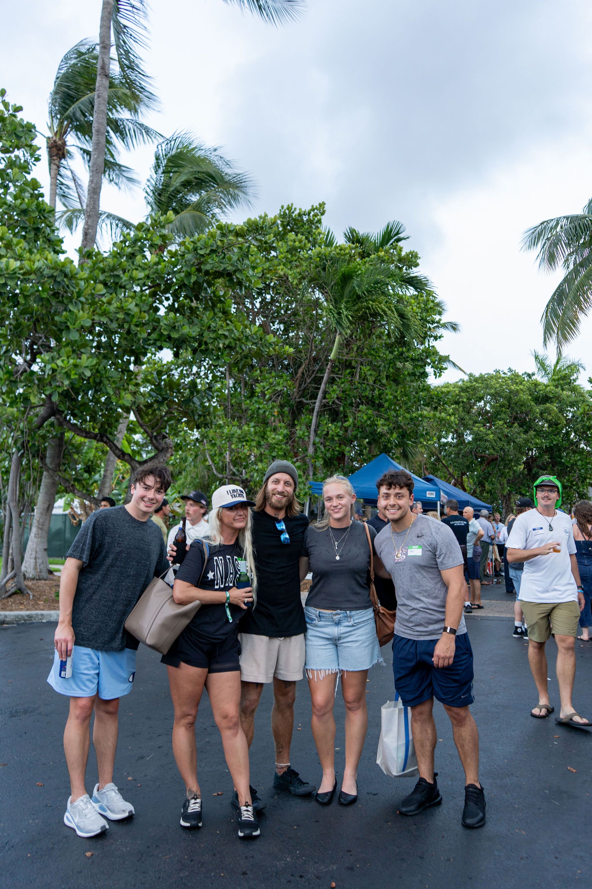 Guests in candid and group photos at The Triton's Fall Triton Expo at Bahia Mar Yachting Center.