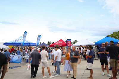 Guests networking at The Triton's Crew, Captains & Connections event at Nautical Ventures Marina.