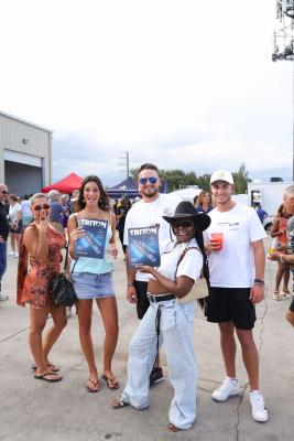 Guests networking at The Triton's Crew, Captains & Connections event at Nautical Ventures Marina.