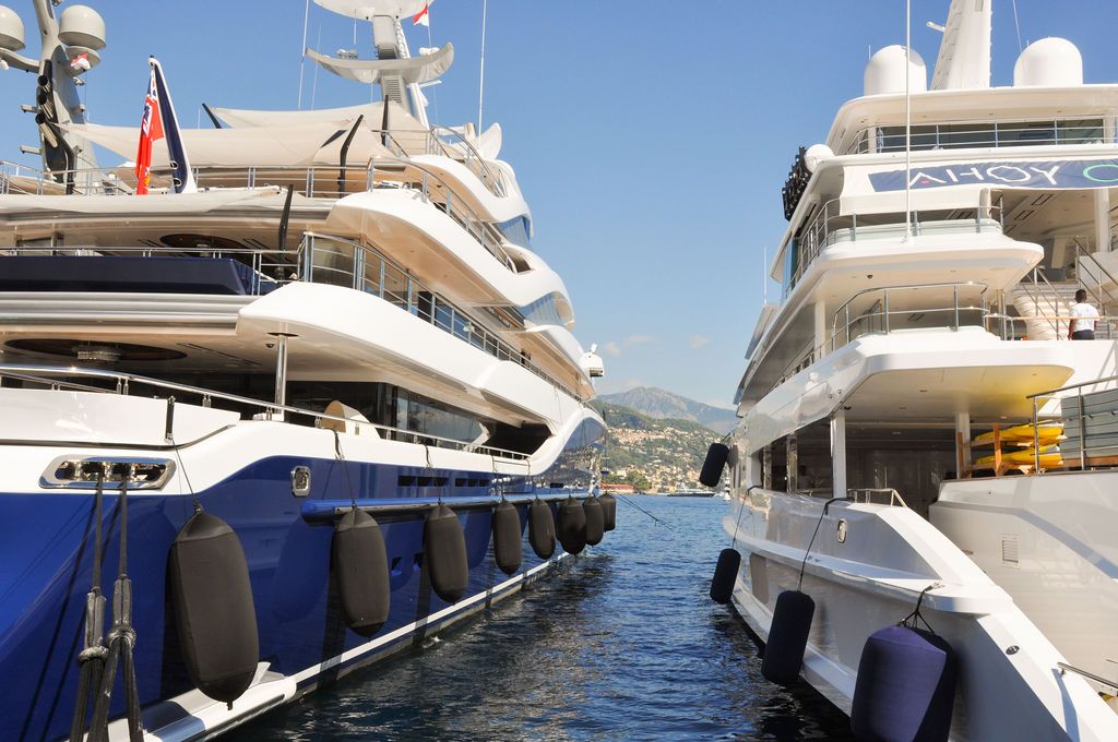 Yachts and crew on the docks at the 2026 Monaco Yacht Show in Port Hercule, Monaco.