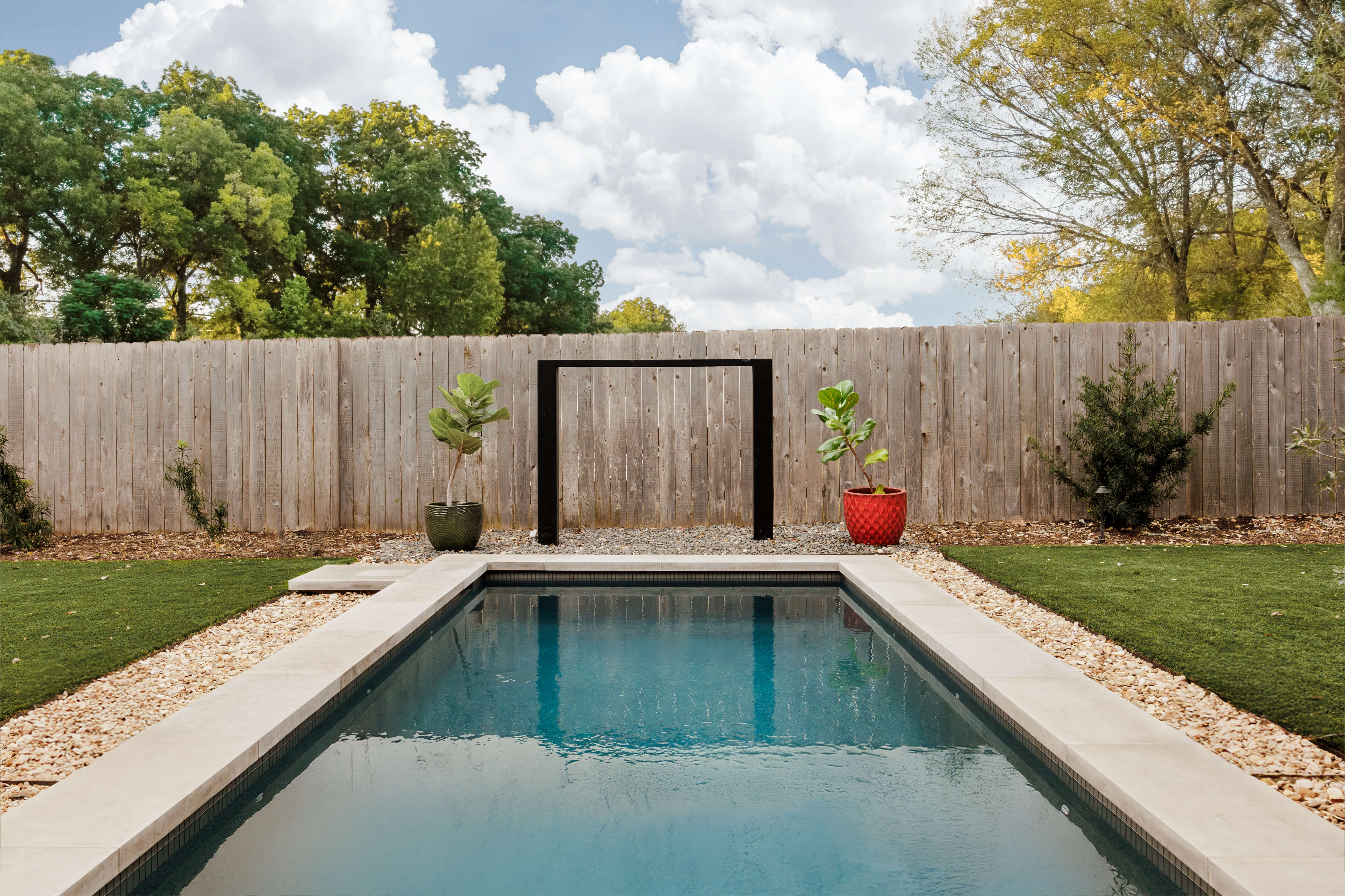 Golden Hour Pools Classic in Dallas, featuring outdoor shower frame and potted plants and gunite plaster finish