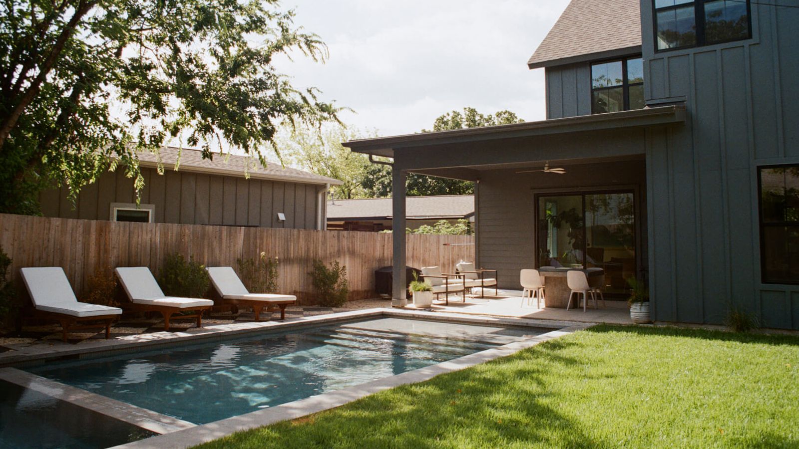 Golden Hour Pools Classic + Spa in Houston, featuring modern farmhouse with chaise lounges and gunite plaster finish