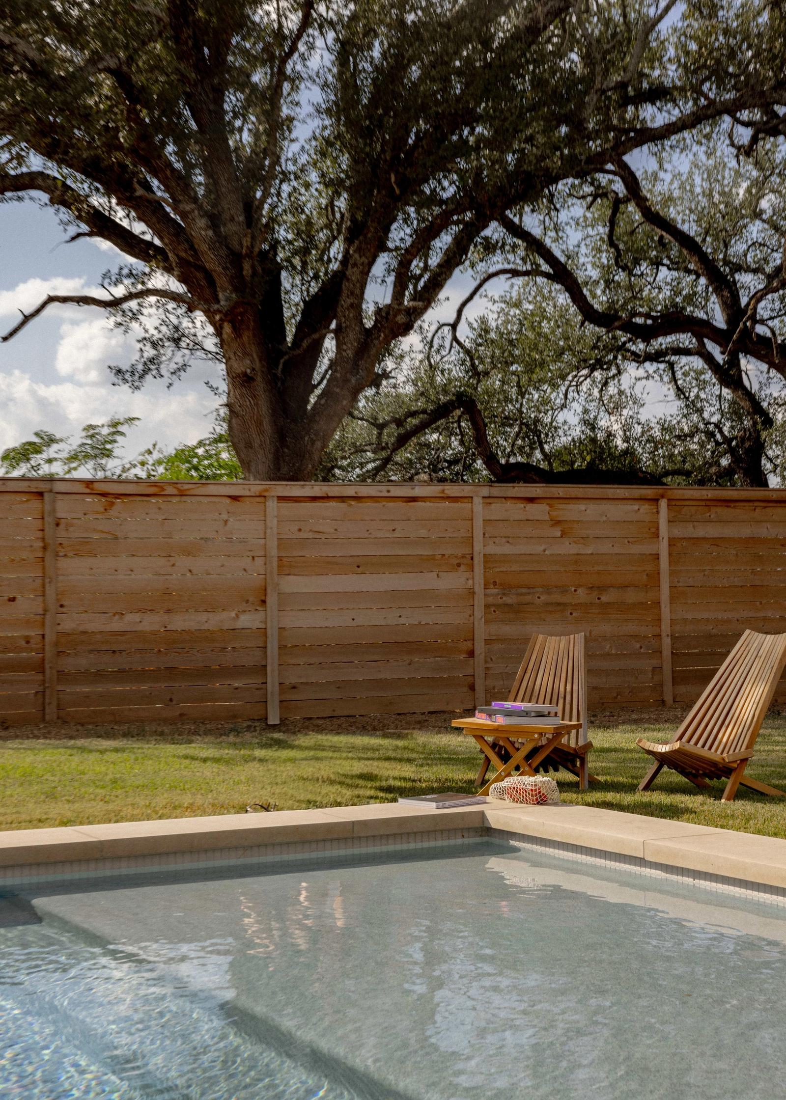 Golden Hour Pools Grand in Waco, featuring full backyard with horizontal fence and gunite plaster finish