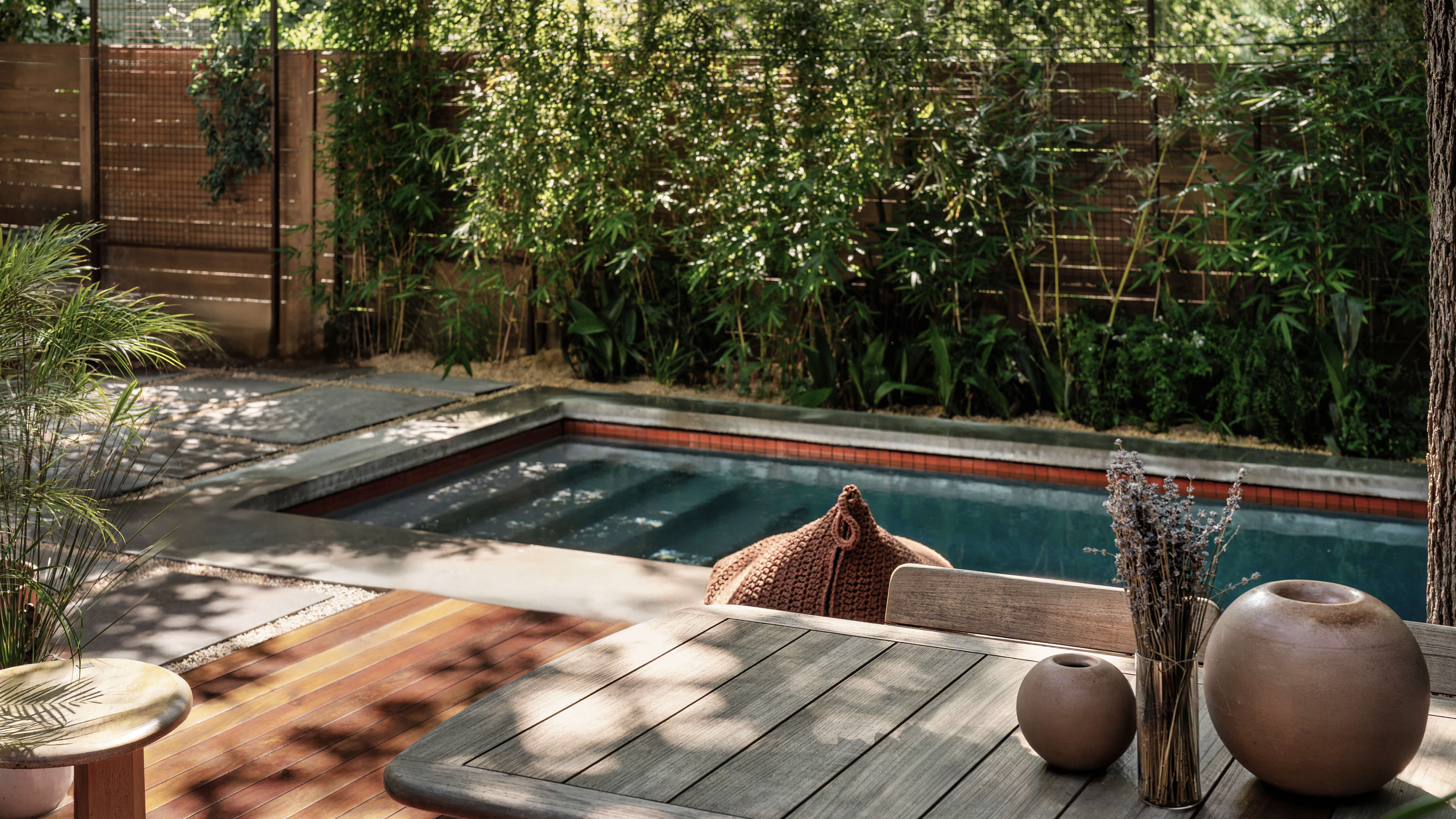 Golden Hour Pools Classic in Austin, featuring Classic pool with dark plaster finish and terracotta waterline tile in Zilker